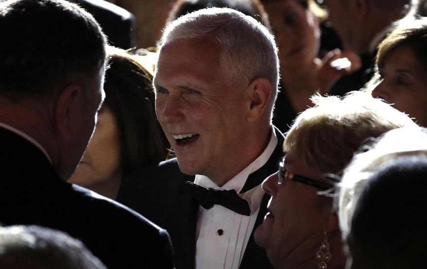Vice president-elect Mike Pence, center, greets supporters at the Indiana Inaugural Ball, Thursday, Jan. 19, 2017 in Washington. (AP Photo/Alex Brandon)