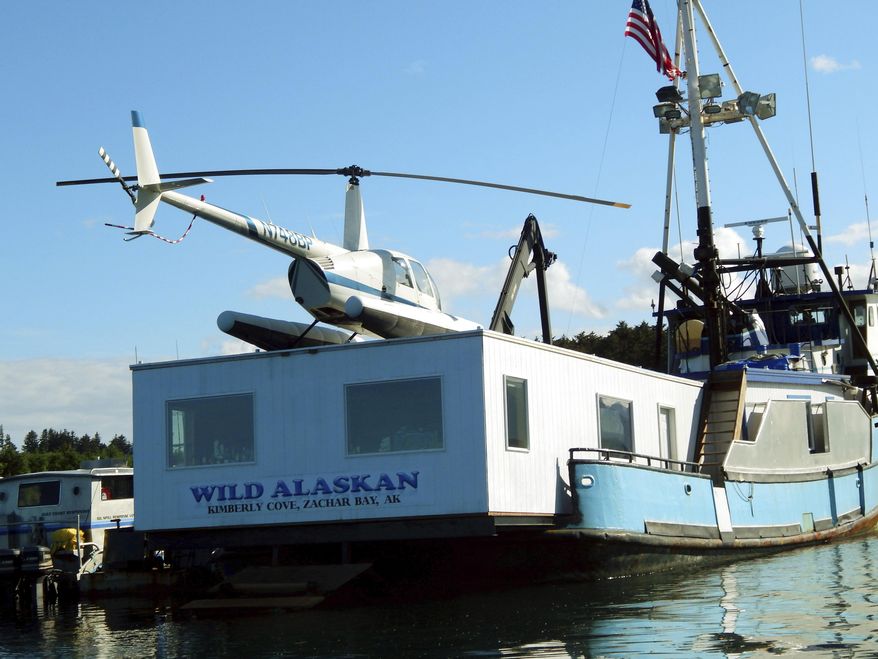 This 2014 photo shows the Wild Alaskan, a converted crabbing boat that had been used as a strip club, moored near downtown Kodiak, Alaska. A sentencing hearing has been rescheduled for Darren Byler, who was found guilty of illegally dumping human waste into a harbor from the boat. Byler had been scheduled for sentencing in Anchorage Thursday, Jan. 19, 2016, but his attorney, John Cashion, said Byler's flight from Kodiak Island was delayed and the sentencing is now set for Friday. (Kodiak Daily Mirror via AP)
