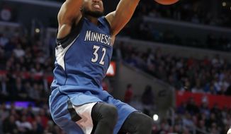 Minnesota Timberwolves center Karl-Anthony Towns dunks during the second half of the team&#39;s NBA basketball game against the Los Angeles Clippers, Thursday, Jan. 19, 2017, in Los Angeles. The Timberwolves won 104-101. (AP Photo/Ryan Kang)