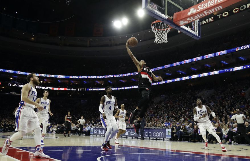 Portland Trail Blazers' C.J. McCollum goes up for a dunk during the first half of an NBA basketball game against the Philadelphia 76ers, Friday, Jan. 20, 2017, in Philadelphia. (AP Photo/Matt Slocum)