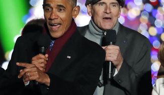 FILE - In this Dec. 1, 2016 file photo, President Barack Obama sings &amp;quot;Jingle Bells&amp;quot; with James Taylor and others during the lighting ceremony for the 2016 National Christmas Tree on the Ellipse near the White House in Washington. Taylor, on vacation in French Polynesia, posted a video online Friday, Jan. 20, 2017, bemoaning the end of the Obama era, saying, &amp;quot;Hi, it&#39;s James on the last day of the Obama administration, and it feels like it&#39;s raining all over the world.&amp;quot; (AP Photo/Alex Brandon)