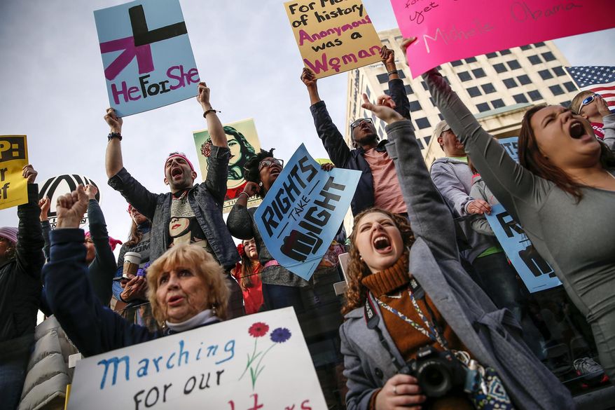 Thousands attend the Women's March Indianapolis rally, a sister rally of the Women's March on Washington, on the west side of the Indiana Statehouse in Indianapolis on Saturday, Jan. 21, 2017. (Mykal McEldowney/The Indianapolis Star via AP)