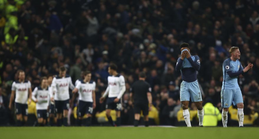 Manchester City's Raheem Sterling wipes his face with his shirt after Tottenham Hotspur's Son Heung-min scored his sides second goal during the English Premier League soccer match between Manchester City and Tottenham Hotspur at the Etihad stadium in Manchester, England, Saturday, Jan., 21, 2017. (AP Photo/Dave Thompson)