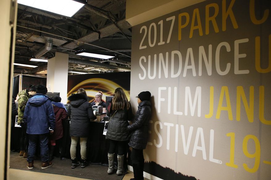 Festival goers visit the Festival Box Office during the 2017 Sundance Film Festival on Saturday, Jan. 21, 2017, in Park City, Utah. Representatives for the Sundance Film Festival say that their network systems were subject to a cyberattack that caused its box offices to shut down briefly Saturday afternoon. (Photo by Danny Moloshok/Invision/AP)