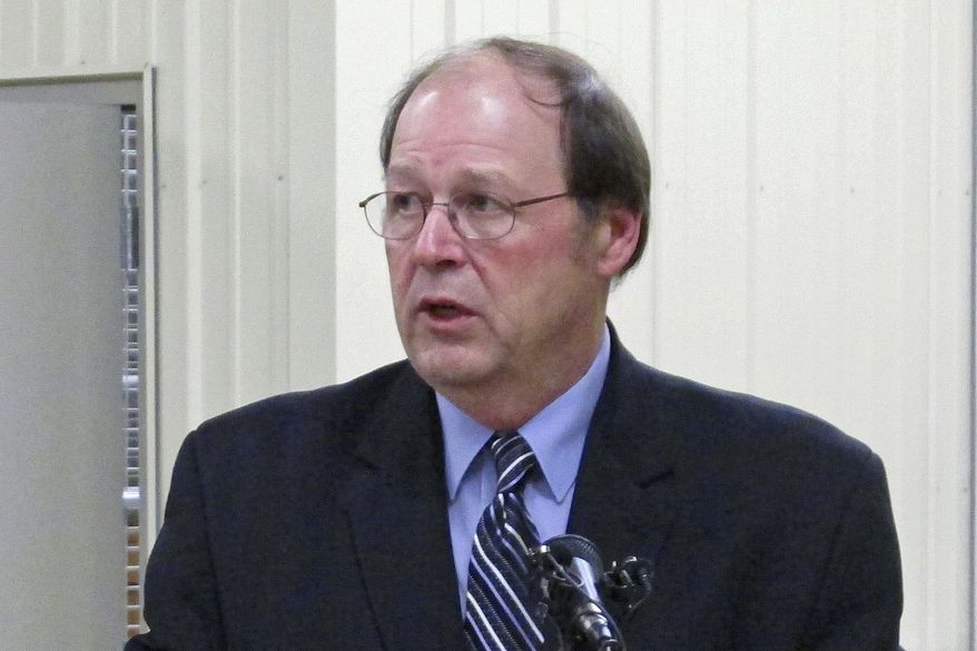 In this Feb. 28, 2013, file photo, Ohio Agriculture Director David Daniels discusses security at the state's holding facility for confiscated exotic animals in Reynoldsburg, Ohio. Daniels says as of early 2017, about 12,000 farmers and fertilizer applicators have completed a three-hour training program that soon will be required to use commercial fertilizer, but he estimates 6,000 to 10,000 farmers still need the certification. The first-of-its-kind requirement, approved by Ohio lawmakers in 2014, is one step the state has taken to reduce farm runoff that feeds toxic algae in lakes and rivers. (AP Photo/Andrew Welsh-Huggins, File)