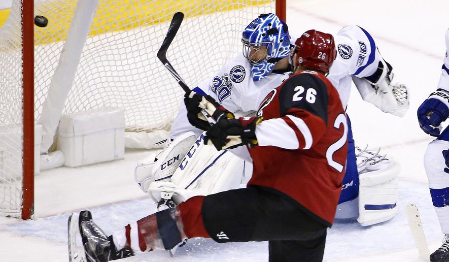 Arizona Coyotes defenseman Michael Stone (26) scores a goal against Tampa Bay Lightning goalie Ben Bishop (30 during the second period of an NHL hockey game Saturday, Jan. 21, 2017, in Glendale, Ariz. (AP Photo/Ross D. Franklin)