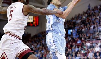 North Carolina forward Justin Jackson (44) drives to the basket ahead of Boston College forward Garland Owens (5) during the first half of an NCAA college basketball game in Boston, Saturday, Jan. 21, 2017. (AP Photo/Mary Schwalm)