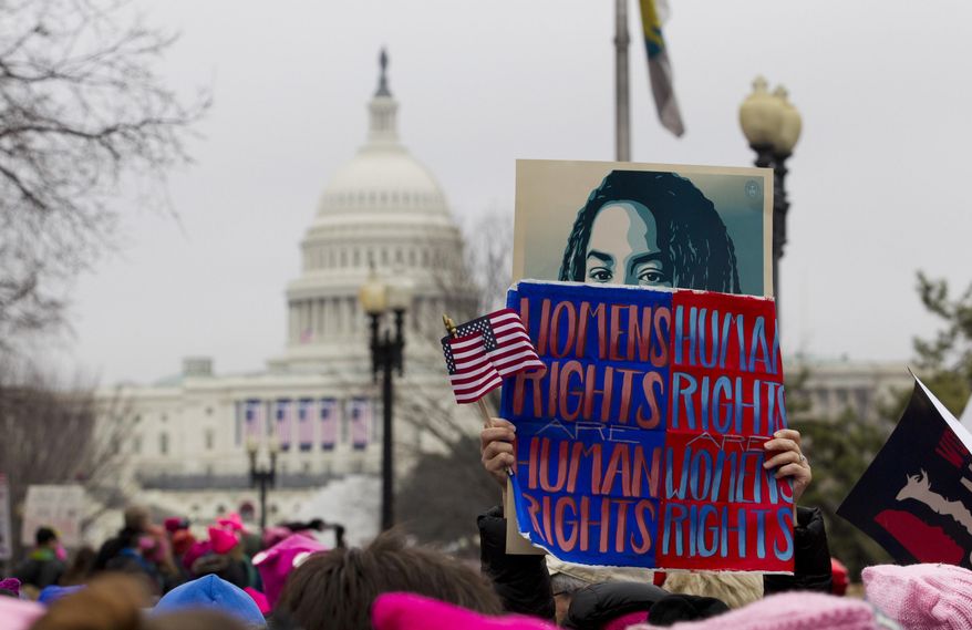 Women rally at Capitol Hill as they make their voices heard on the first full day of Donald Trump's presidency, Saturday, Jan. 21, 2017 in Washington. Organizers of the Women's March on Washington expect more than 200,000 people to attend the gathering. Other protests are expected in other U.S. cities. ( AP Photo/Jose Luis Magana)