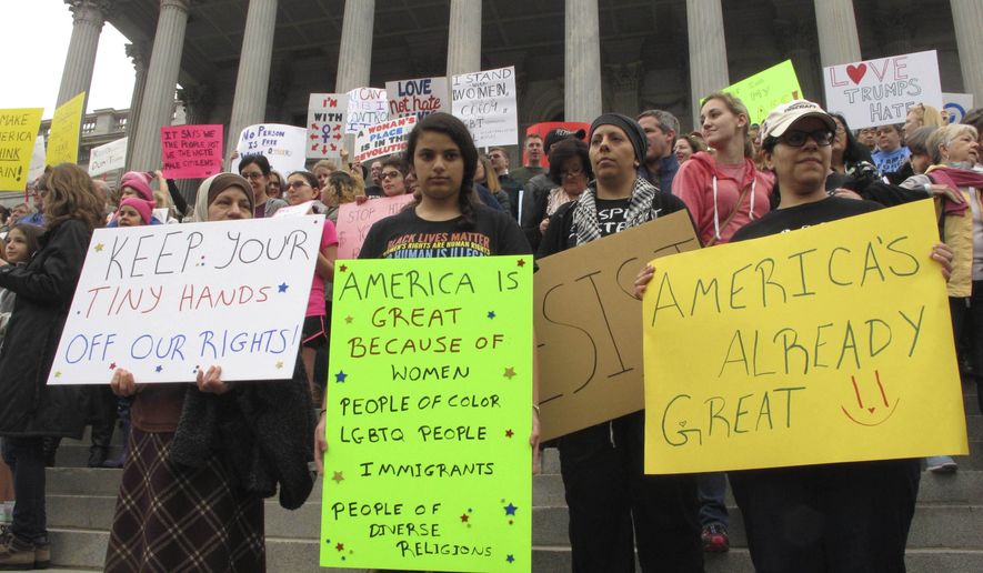 Thousands of women gather for the Stand Up Rally for women and minority rights on Saturday, Jan. 21, 2017, at the Statehouse in Columbia, S.C. Similar rallies were being held across the country to protest President Donald Trump and his administration. (AP Photo/Jeffrey Collins)