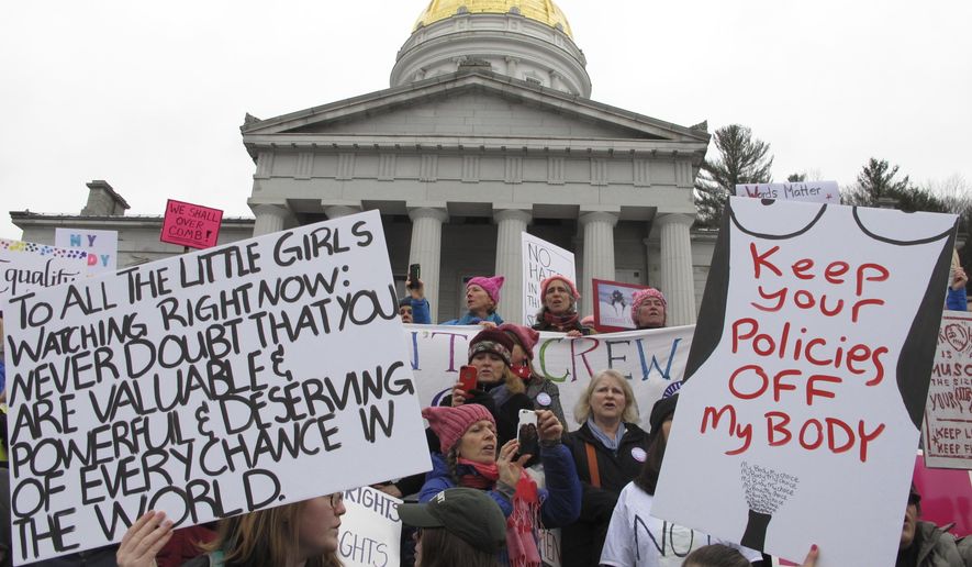 Demonstrators participate in a women's march and rally in Montpelier, Vt., on Saturday Jan. 21, 2017. The march is being held in solidarity with similar events taking place in Washington and around the nation. (AP Photo/Lisa Rathke)