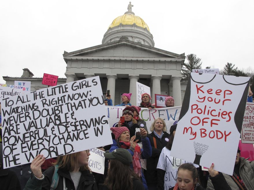 Demonstrators participate in a women's march and rally in Montpelier, Vt., on Saturday Jan. 21, 2017. The march is being held in solidarity with similar events taking place in Washington and around the nation. (AP Photo/Lisa Rathke)
