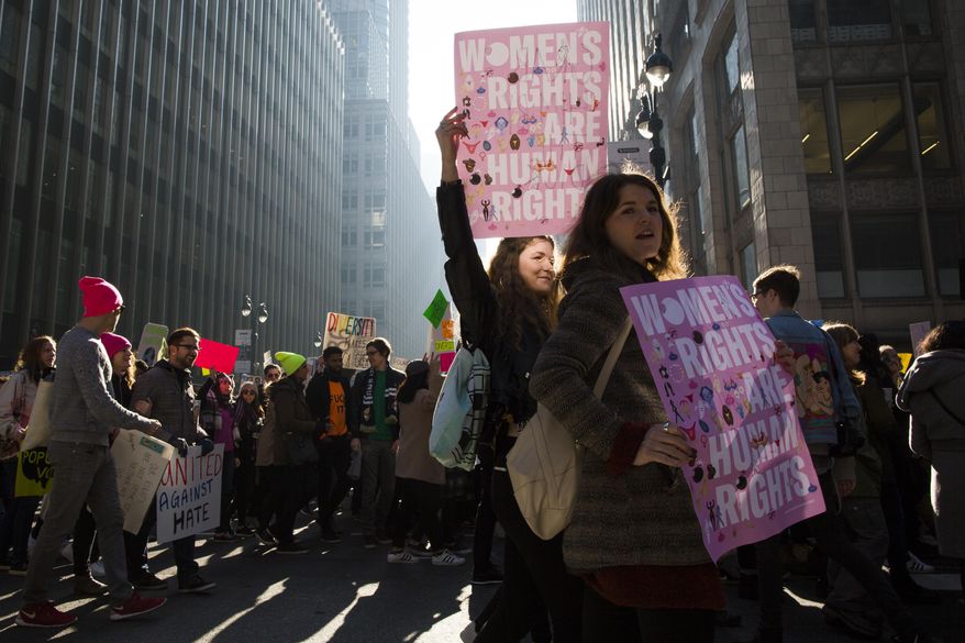 Demonstrators across Madison Avenue during a women's march, Saturday, Jan. 21, 2017, in New York. The march is being held in solidarity with similar events taking place in Washington and around the nation. (AP Photo/Mary Altaffer)