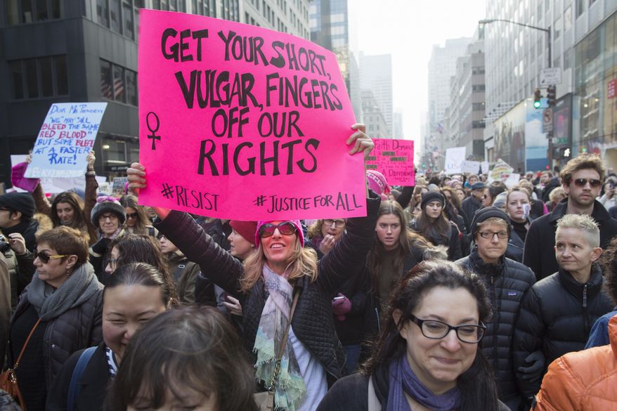 Demonstrators march up 5th Avenue during a women's march, Saturday, Jan. 21, 2017, in New York. The march is being held in solidarity with similar events taking place in Washington and around the nation. (AP Photo/Mary Altaffer)