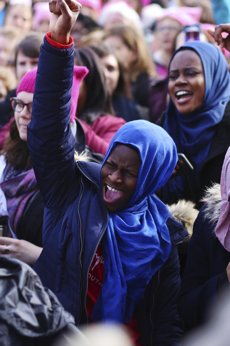 A women cheers during the Women's March at the Lansing State Capito in Lansing, Mich.,l on Saturday, Jan. 21, 2017. (Samantha Madar /Jackson Citizen Patriot via AP)