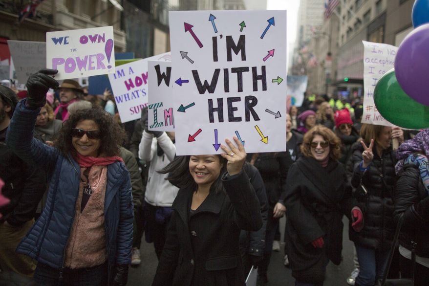 Demonstrators march up 5th Avenue during a women's march, Saturday, Jan. 21, 2017, in New York. The march is being held in solidarity with similar events taking place in Washington and around the nation. (AP Photo/Mary Altaffer)