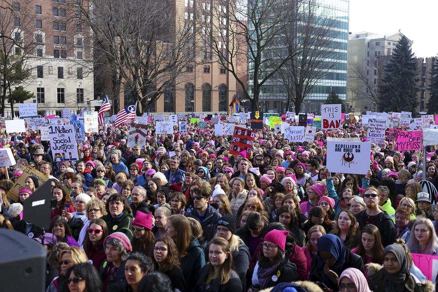 Thousands of people gather at the Lansing State Capitol for the Women's March on Saturday, Jan. 21, 2017. (Samantha Madar /Jackson Citizen Patriot via AP)