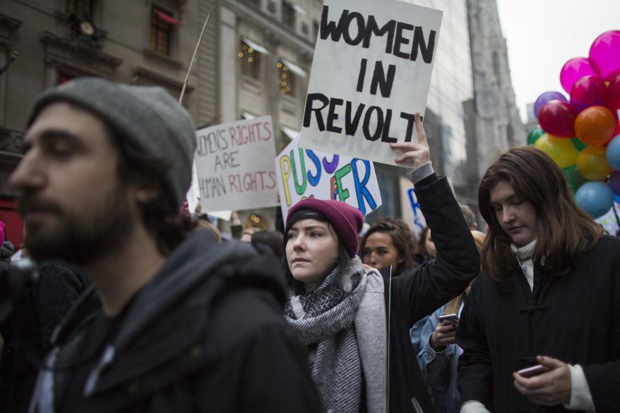 Demonstrators march up 5th Avenue during a women&#39;s march, Saturday, Jan. 21, 2017, in New York. The march is being held in solidarity with similar events taking place in Washington and around the nation. (AP Photo/Mary Altaffer)