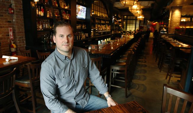 In this Dec. 23, 2016 photo, owner Dylan Welsh poses in Worden Hall restaurant in Boston. Welsh said Seattle Storm guard Sue Bird, of the WNBA, is a long-time friend and co-investor in his restaurants. (AP Photo/Michael Dwyer)