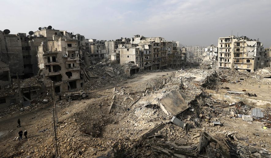Mounds of rubble used to be high-rise apartment buildings in the once rebel-held Ansari neighborhood in eastern Aleppo, Syria. Residents have been evacuated and are now refugees. (Associated Press)