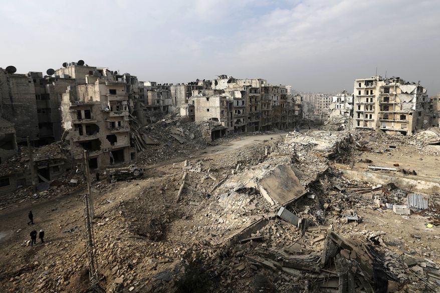 Mounds of rubble used to be high-rise apartment buildings in the once rebel-held Ansari neighborhood in eastern Aleppo, Syria. Residents have been evacuated and are now refugees. (Associated Press)