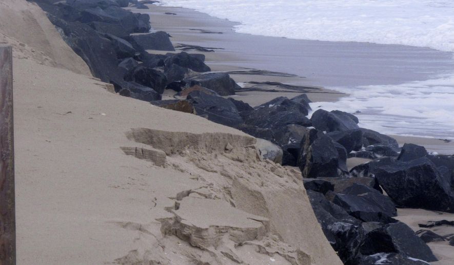 This Oct. 5, 2015 photo shows a privately installed rock wall in Bay Head N.J. exposed to the ocean waves after a storm. Oceanfront homeowners want a judge to exempt them from a plan by Republican Gov. Chris Christie to erect protective sand dunes along New Jersey’s entire 127-mile coastline. arguing that their privately funded rock wall provides better protection at no cost to taxpayers. (AP Photo/Wayne Parry)