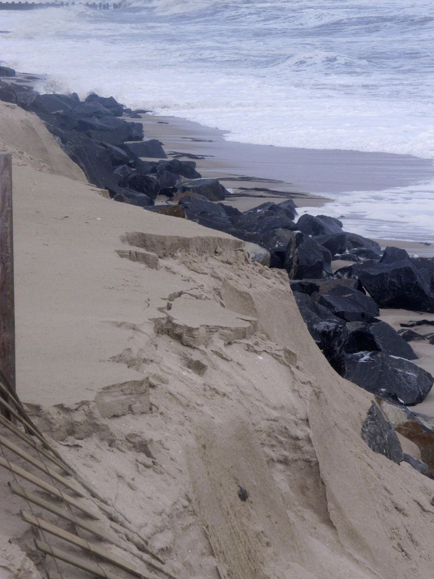 This Oct. 5, 2015 photo shows a privately installed rock wall in Bay Head N.J. exposed to the ocean waves after a storm. Oceanfront homeowners want a judge to exempt them from a plan by Republican Gov. Chris Christie to erect protective sand dunes along New Jersey’s entire 127-mile coastline. arguing that their privately funded rock wall provides better protection at no cost to taxpayers. (AP Photo/Wayne Parry)
