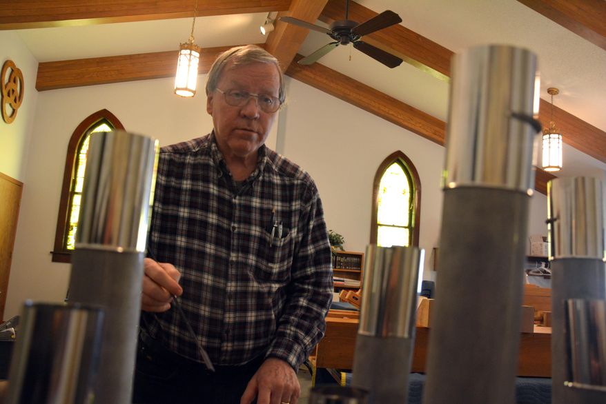 FOR RELEASE SUNDAY, JANUARY 22, 2017, AT 12:01 A.M. CST.- John Nolte, of Nolte Organ Building from West Allis, Wis. tests pipes that have been altered for the organ at St. Paul Lutheran Church of Plymouth. The project cost just shy of $10,000. (Scott Koperski /Beatrice Daily Sun via AP)