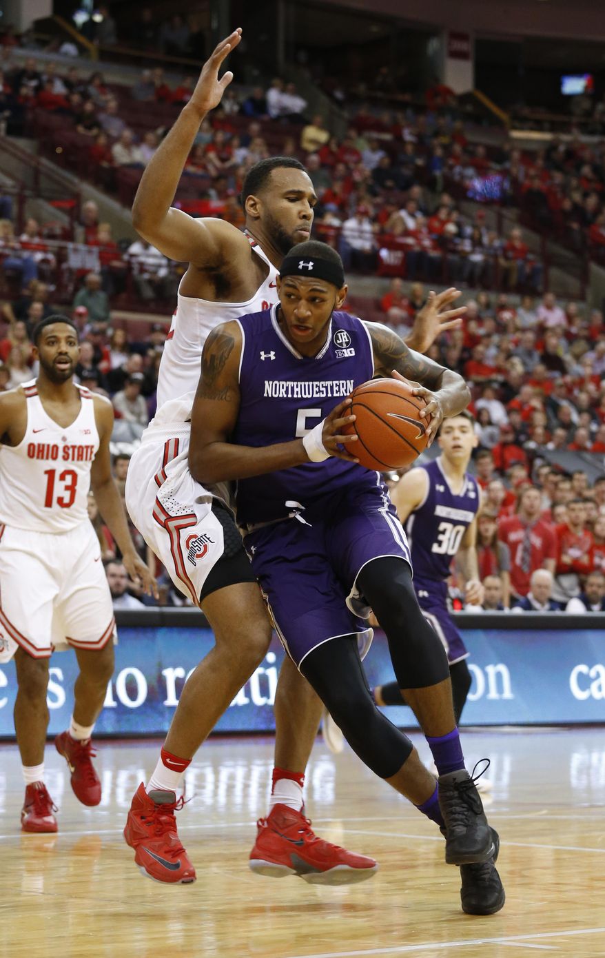 Northwestern&#39;s Dererk Pardon, front, drives to the basket against Ohio State&#39;s Trevor Thompson during the first half of an NCAA college basketball game Sunday, Jan. 22, 2017, in Columbus, Ohio. (AP Photo/Jay LaPrete)