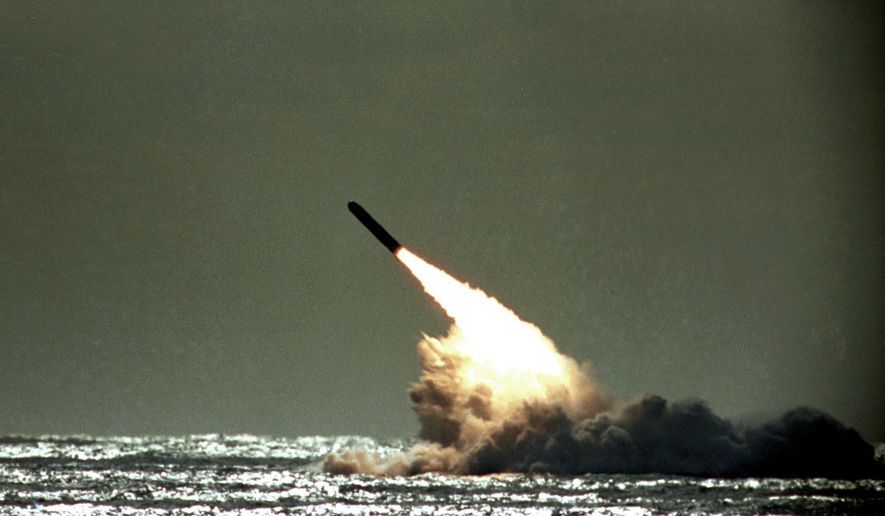 FILE - In this file photo dated Monday, Dec. 4, 1989,  a Trident II missile launched by the U.S. Navy during a performance evaluation from the submerged submarine USS Tennessee in the Atlantic Ocean off the coast of Cape Canaveral in Titusville, Fla., USA. According to Britain&#39;s Sunday Times newspaper published Sunday Jan. 22, 2017, an unarmed nuclear test missile fired by a British submarine off the coast of Florida in 2016,  misfired and the failure was allegedly covered up ahead of a debate in Parliament on the future of the Trident missile system. British Prime Minister Theresa May has refused to say whether she knew about the reported failure. (AP Photo/Phil Sandlin, FILE)