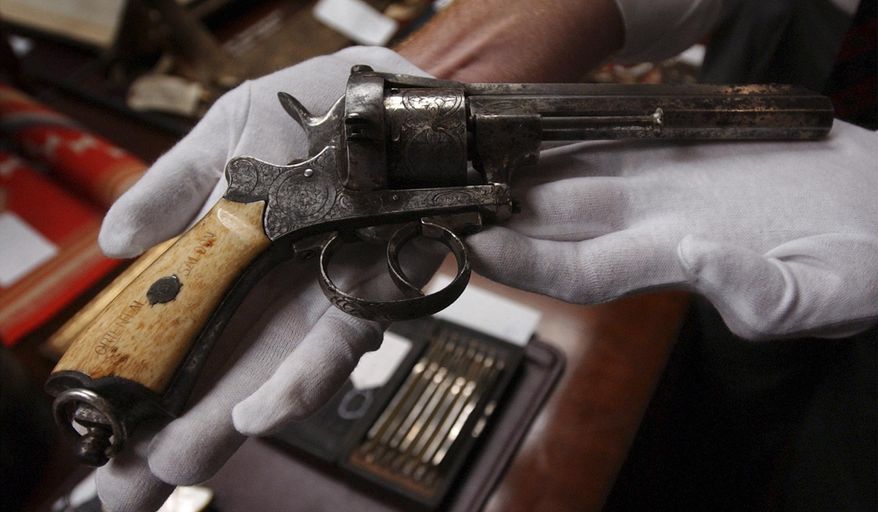 FILE – This July 10, 2003 file photo shows an 1800s revolver that entrepreneur, gambler and lawman Wyatt Earp kept in the Oriental Saloon in Tombstone in the Arizona Territory, displayed at the Harrisburg, Pa., Mayor Stephen Reed's office in Harrisburg. Jury selection is set to begin Monday, Jan. 23, 2017, in the criminal case against Reed, charged with receiving stolen property after spending millions in public funds to buy artifacts for a Wild West museum that was never built. His lawyer says Reed didn't steal anything and was in lawful possession of the items. (AP Photo/Carolyn Kaster, File)