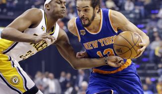New York Knicks center Joakim Noah (13) drives on Indiana Pacers center Myles Turner (33) during the first half of an NBA basketball game in Indianapolis, Monday, Jan. 23, 2017. (AP Photo/Michael Conroy)