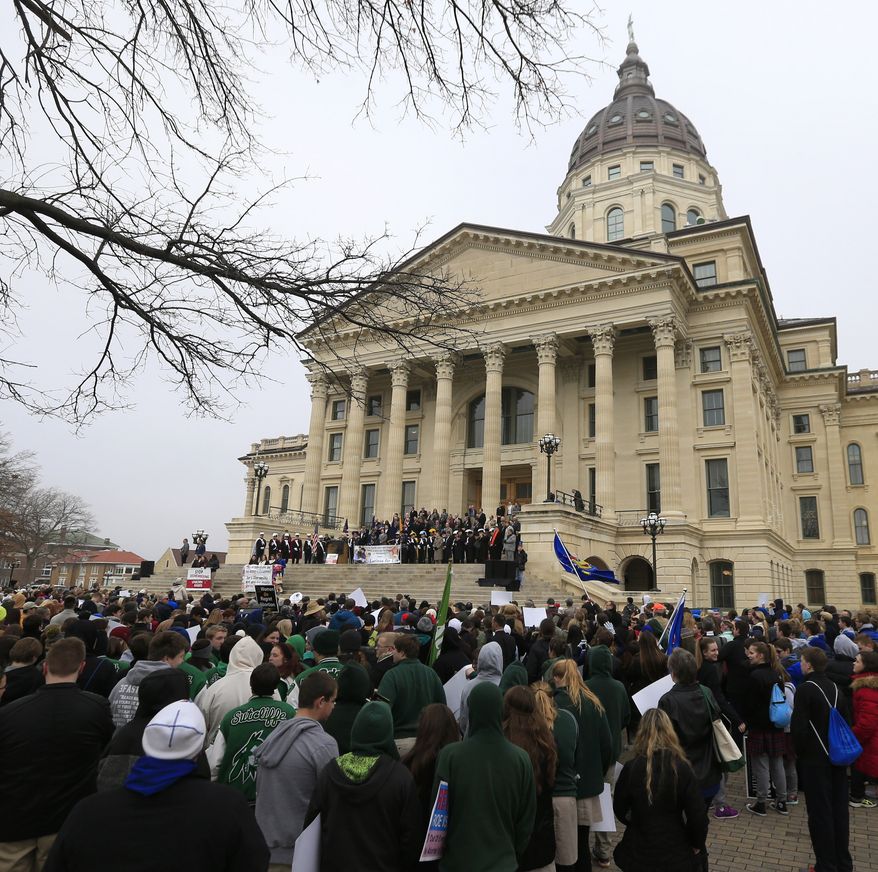 Pro-life activists rally at the Kansas Statehouse on Monday to mark the 1973 Supreme Court decision that legalized abortion nationwide. (Associated Press)