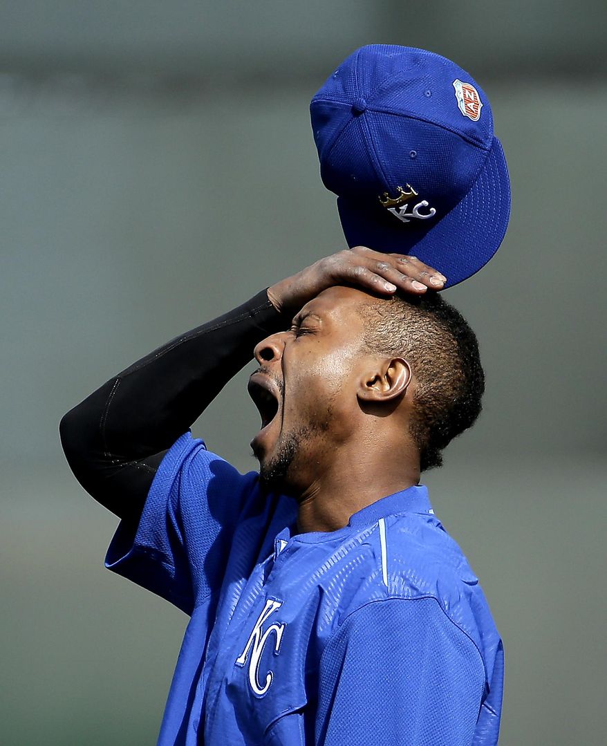 FILE - In this Feb. 23, 2016, file photo, Kansas City Royals&#39; Jarrod Dyson yawns as he waits to field balls during spring training baseball practice in Surprise, Ariz. Researchers say they’ve documented an unseen drag on major league baseball players that can wipe out home field advantage, make pitchers give up more home runs, and take some punch out of a team&#39;s bats. The culprit: jet lag. (AP Photo/Charlie Riedel, File)