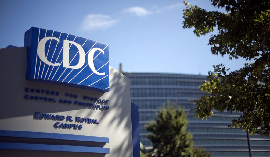 In this Oct. 8, 2013, file photo, a sign marks the entrance to the federal Centers for Disease Control and Prevention (CDC) in Atlanta. (AP Photo/David Goldman, File) **FILE**