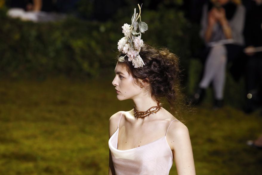 A model wears a creation for Christian Dior's Haute Couture Spring-Summer 2017 fashion collection presented in Paris, Monday, Jan. 23, 2017. (AP Photo/Francois Mori)