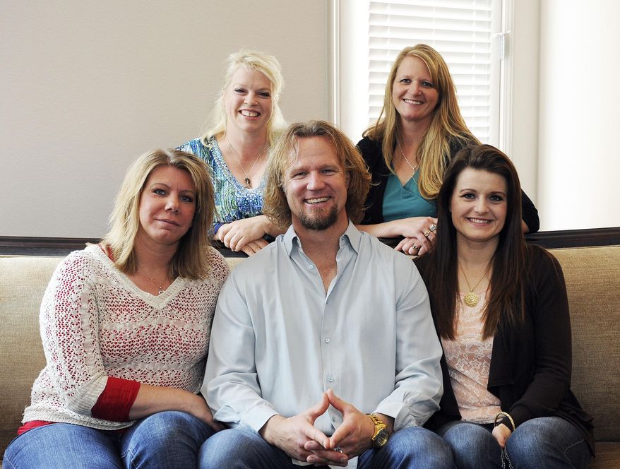 FILE - In this July 10, 2013, file photo, Kody Brown poses with his wives at one of their homes in Las Vegas. The Supreme Court said Monday, Jan 24, 2017, it won't hear an appeal from the family on TV's "Sister Wives" challenging Utah's law banning polygamy. The decision ends the family's long legal fight to overturn a seldom used and unique provision of Utah's law that the Browns and other polygamous families contend has a chilling effect by sending law-abiding plural families into hiding because of fear of prosecution. (Jerry Henkel/Las Vegas Review-Journal, via AP, File)