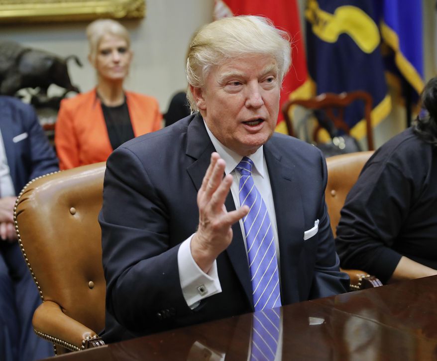 President Donald Trump gestures during his meeting with labor leaders in the Roosevelt Room of the White House in Washington, Monday, Jan. 23, 2017. (AP Photo/Pablo Martinez Monsivais)
