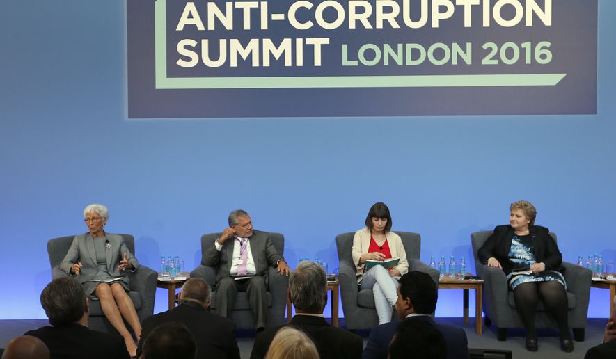 In this Thursday, May 12, 2016 file photo, Christine Lagarde, Managing Director of the International Monetary Fund, from left, Jose Ugaz, Transparency International, Daria Kaleniuk and Norway&#39;s Prime Minister Erna Solberg take part in a panel discussion at the Anti-Corruption Summit in London. Watchdog group Transparency International on Wednesday Jan. 25, 2017, is warning that people who turn to populist politicians who promise to change systems and end corruption may only be feeding the problem. (AP Photo/Frank Augstein, Pool, File)