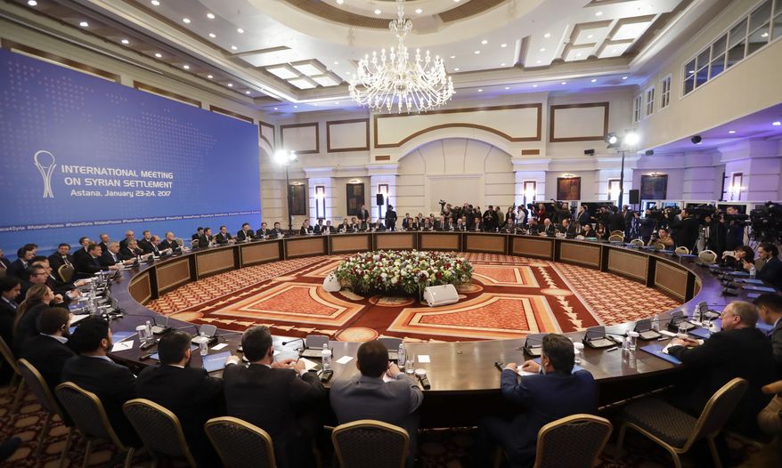 Delegations of Russia, Iran and Turkey hold talks on Syrian peace at a hotel in Astana, Kazakhstan, Monday, Jan. 23, 2017. The talks are the latest attempt to forge a political settlement to end a war that has by most estimates killed more than 400,000 people since March 2011 and displaced more than half the country's population. (AP Photo/Sergei Grits)