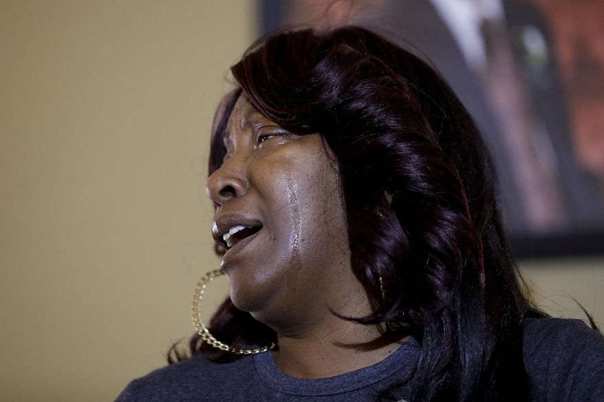 Ezell Ford's mother, Tritobia Ford, sheds tears while speaking at a news conference Tuesday, Jan. 24, 2017, in Los Angeles. Two Los Angeles police officers acted in self-defense when they fatally shot the 25-year-old black man during a struggle over an officer's gun and will not face criminal charges for the 2014 shooting that led to protests, prosecutors said Tuesday. (AP Photo/Jae C. Hong)