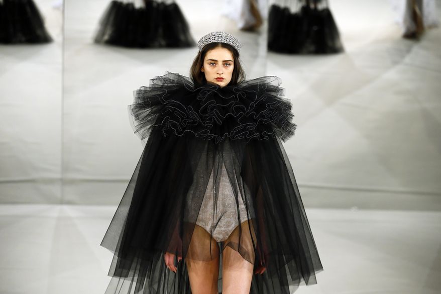 A model wears a creation by Alexis Mabille during his Haute Couture Spring-Summer 2017 fashion collection presented in Paris, Tuesday, Jan. 24, 2017. (AP Photo/Francois Mori)