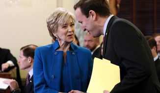 Small Business Administration Administrator-designate, former wrestling entertainment executive, Linda McMahon shakes hands with Sen. Chris Murphy, D-Conn. on Capitol Hill in Washington, Tuesday, Jan. 24, 2017, prior to her confirmation before the Senate Small Business and Entrepreneurship Committee. (AP Photo/Alex Brandon)