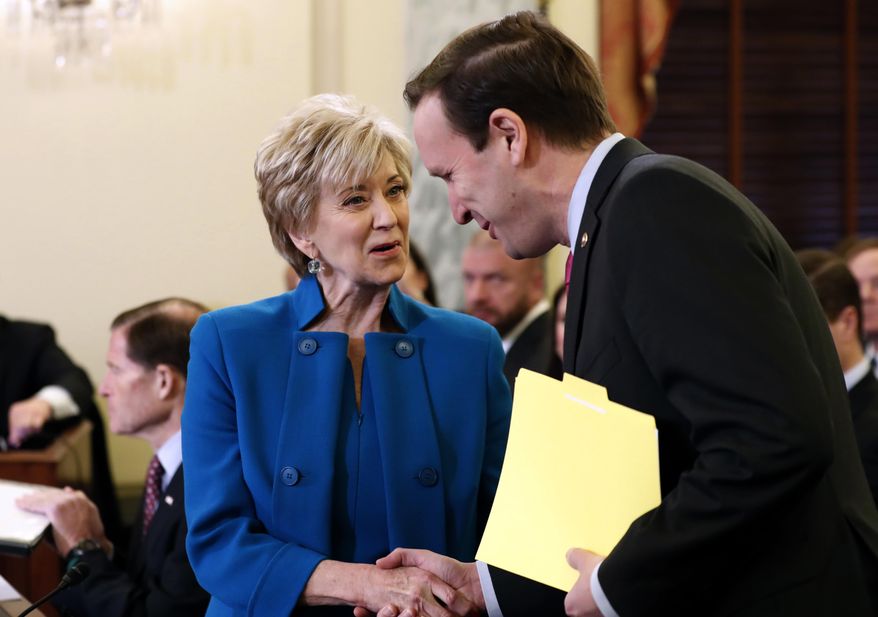 Small Business Administration Administrator-designate, former wrestling entertainment executive, Linda McMahon shakes hands with Sen. Chris Murphy, D-Conn. on Capitol Hill in Washington, Tuesday, Jan. 24, 2017, prior to her confirmation before the Senate Small Business and Entrepreneurship Committee. (AP Photo/Alex Brandon)