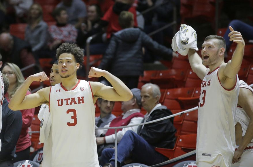 FILE - In this Thursday, Jan. 12, 2017, file photo, Utah's Devon Daniels (3) and David Collette (13) celebrate on the bench in the second half during an NCAA college basketball game of their 86-64 win over Southern California in Salt Lake City. The Utes have exceeded expectations after being picked to finish No. 8 in the Pac-12. Hhowever, the team is still searching for a signature win, and it gets the chance this week against No. 10 Oregon at home. (AP Photo/Rick Bowmer)