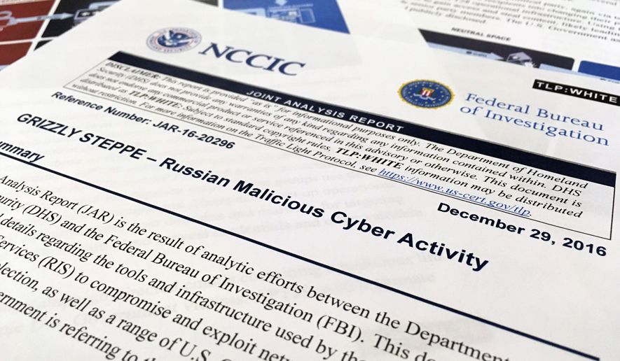 The first page of the Joint Analysis Report narrative by the Department of Homeland Security and federal Bureau of Investigation and released on Dec. 29, 2016, is photographed in Washington, Jan. 6, 2017. Computer security specialists say the technical details in the narrative that the U.S. said would show whether computers had been infiltrated by Russian intelligence services were poorly done and potentially dangerous. Cybersecurity firms ended up counseling their customers to proceed with extreme caution after a slew of false positives led back to sites such as Amazon and Yahoo Inc. Companies and organizations were following the governments advice Dec. 29 and comparing digital logs recording incoming network traffic to their computers and finding matches to a list of hundreds of internet addresses the Homeland Security Department had identified as indicators of malicious Russian intelligence services cyber activity. (AP Photo/Jon Elswick)
