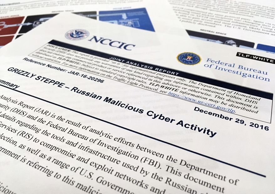 The first page of the Joint Analysis Report narrative by the Department of Homeland Security and federal Bureau of Investigation and released on Dec. 29, 2016, is photographed in Washington, Jan. 6, 2017. Computer security specialists say the technical details in the narrative that the U.S. said would show whether computers had been infiltrated by Russian intelligence services were poorly done and potentially dangerous. Cybersecurity firms ended up counseling their customers to proceed with extreme caution after a slew of false positives led back to sites such as Amazon and Yahoo Inc. Companies and organizations were following the governments advice Dec. 29 and comparing digital logs recording incoming network traffic to their computers and finding matches to a list of hundreds of internet addresses the Homeland Security Department had identified as indicators of malicious Russian intelligence services cyber activity. (AP Photo/Jon Elswick)
