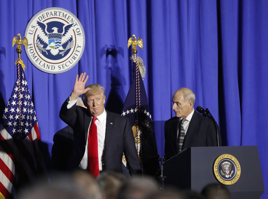 President Donald Trump, followed by Homeland Security Secretary John F. Kelly, waves as he steps off stage after speaking at the Homeland Security Department in Washington, Wednesday, Jan. 25, 2017.  (AP Photo/Pablo Martinez Monsivais)