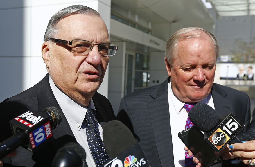 Former Maricopa County Sheriff Joe Arpaio, left, speaks to the media alongside his attorney Mel McDonald, right, as the two leave U.S. District Court after Arpaio's latest hearing in the criminal contempt-of-court case against him for violating a judge's orders in a racial profiling case Wednesday, Jan. 25, 2017, in Phoenix. (AP Photo/Ross D. Franklin)