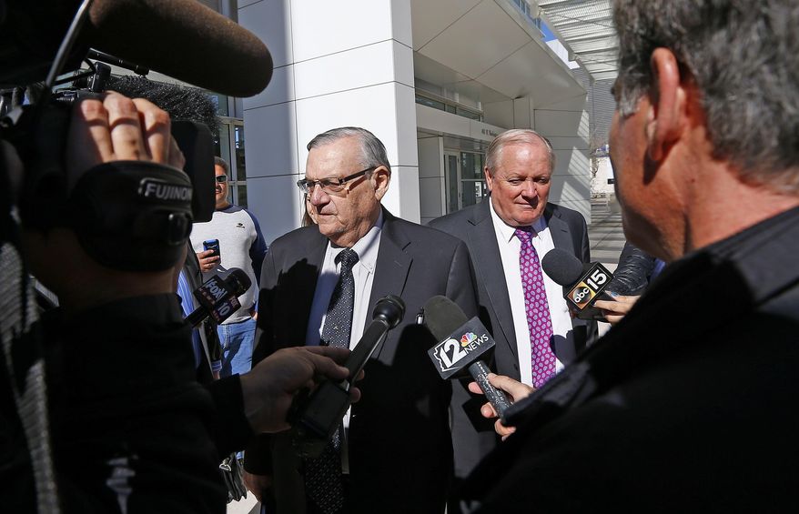 Former Maricopa County Sheriff Joe Arpaio, left, along with his attorney Mel McDonald, right, leave U.S. District Court after Arpaio's latest hearing in the criminal contempt-of-court case against him for violating a judge's orders in a racial profiling case Wednesday, Jan. 25, 2017, in Phoenix. (AP Photo/Ross D. Franklin)