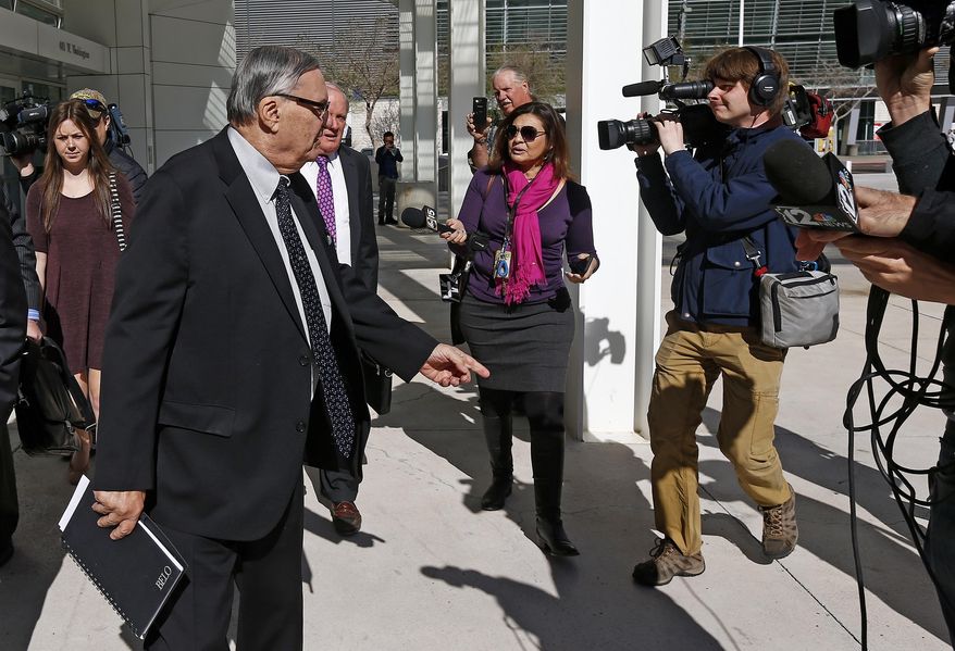 Former Maricopa County Sheriff Joe Arpaio, left, speaks to the media as he leaves U.S. District Court for his latest hearing in the criminal contempt-of-court case against him for violating a judge's orders in a racial profiling case Wednesday, Jan. 25, 2017, in Phoenix. (AP Photo/Ross D. Franklin)